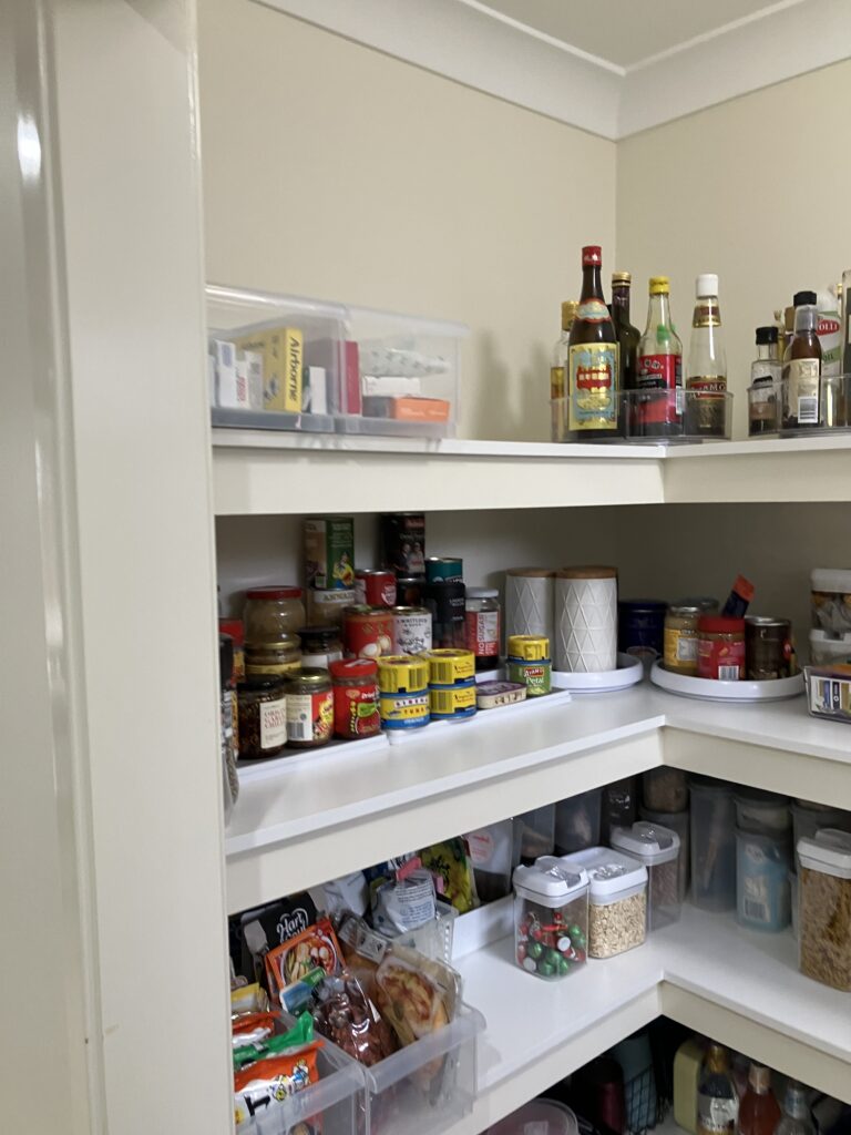 Organised walk-in pantry after decluttering