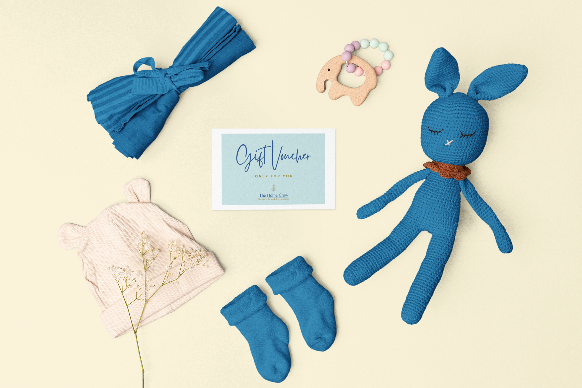 mockup-of-a-greeting-card-placed-around-baby-toys-and-clothes-m26987